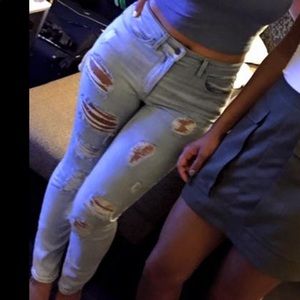 Highly distressed light jeans